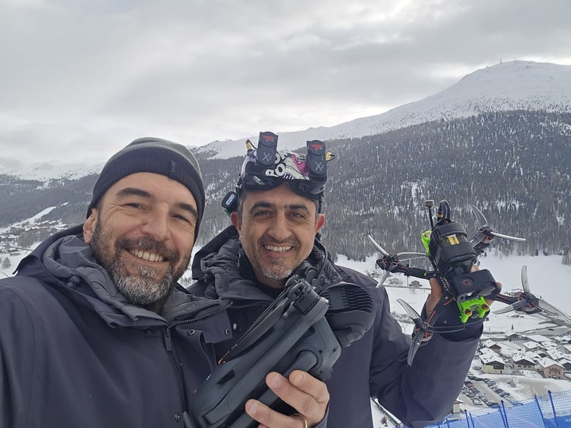 Selfie on the mountain with a colleague and the drone